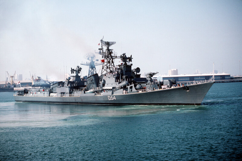 Gray Warship in Harbor