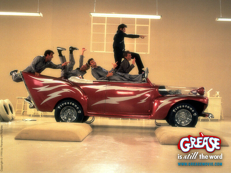 Grease movie cast on a car