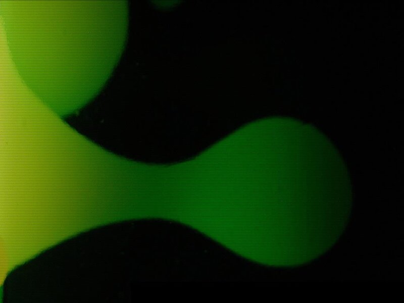 green abstract shapes on black