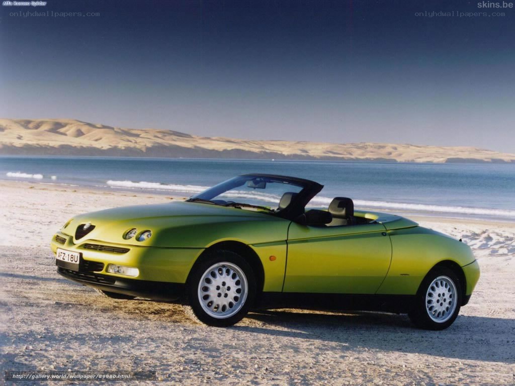 Green Alfa Romeo Spider on beach