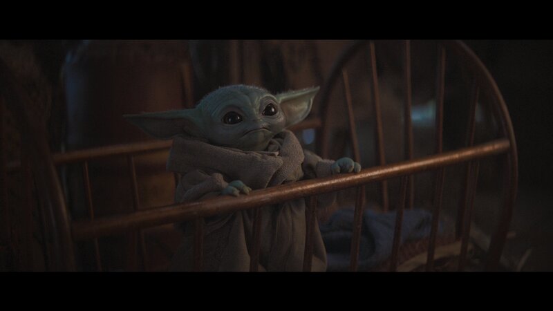 Green Alien Baby in Crib