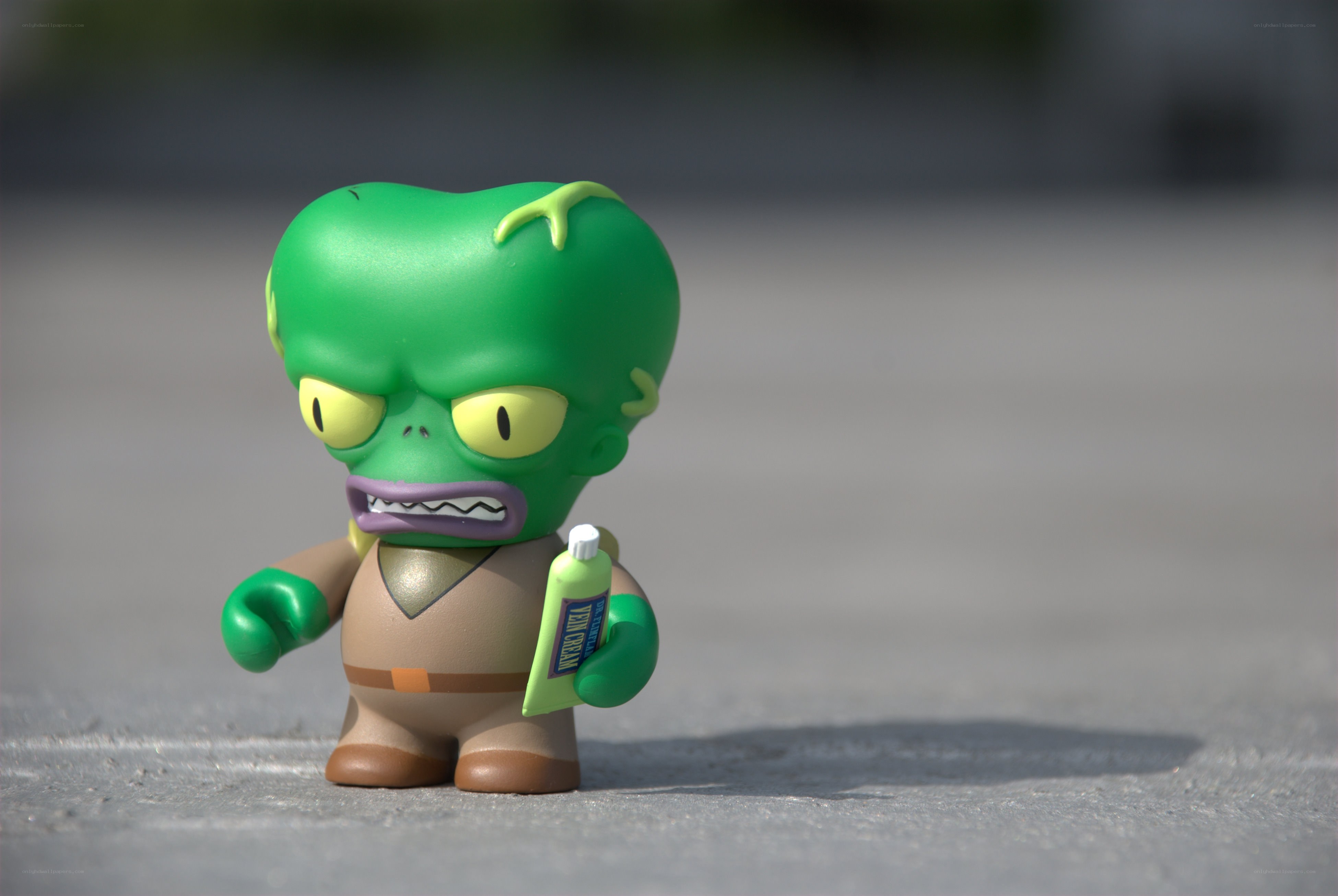green alien figurine with cream
