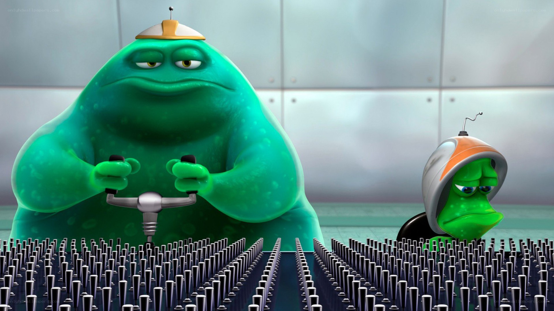 green aliens at control panel