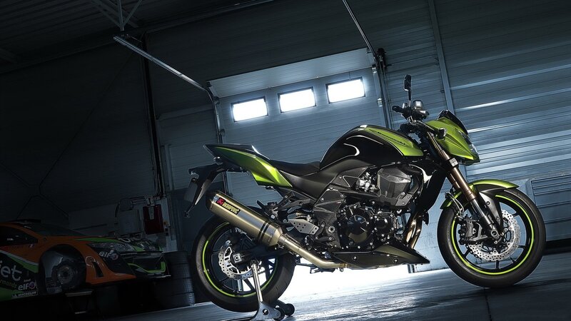 green and black motorcycle in garage