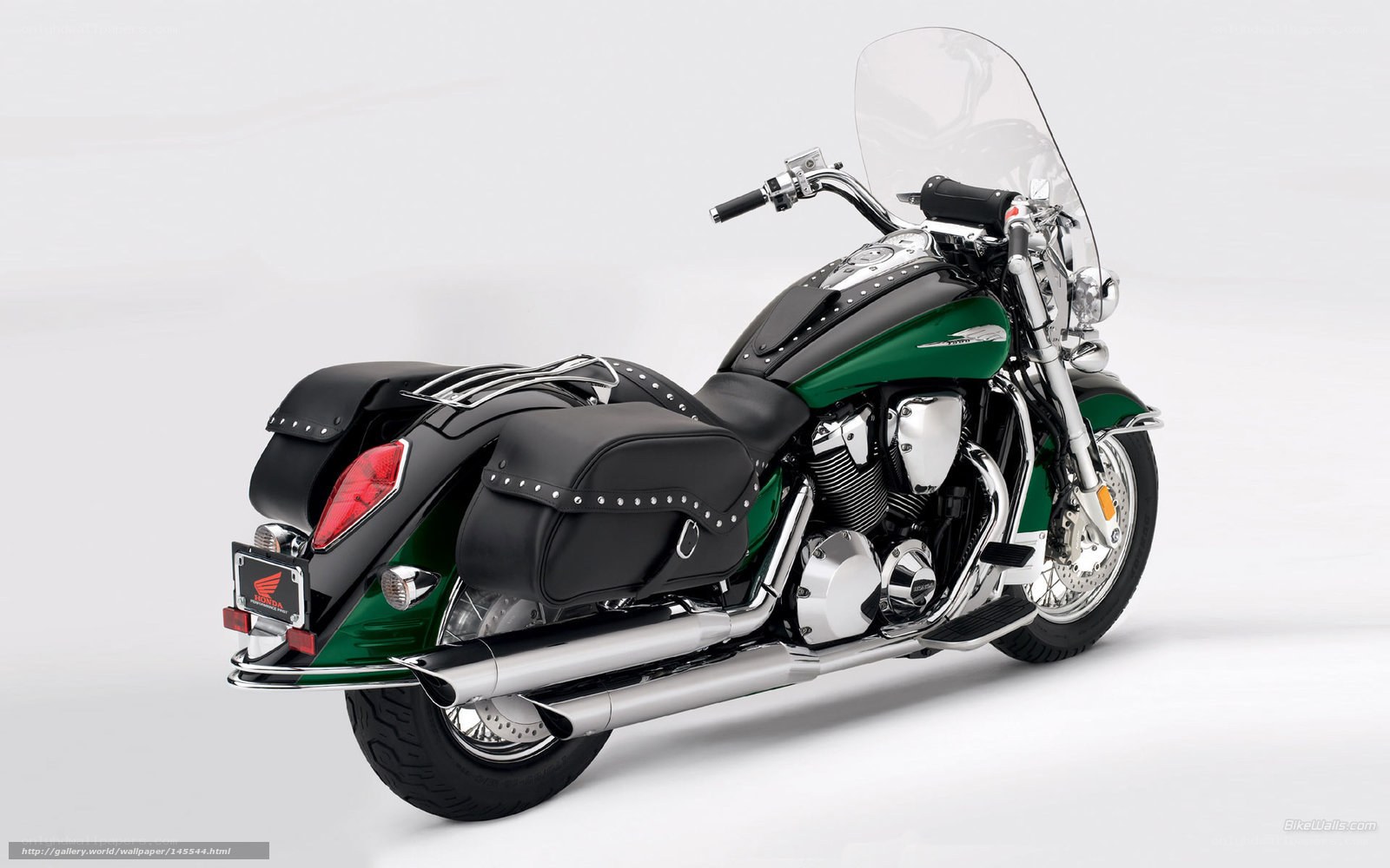 green and black touring motorcycle