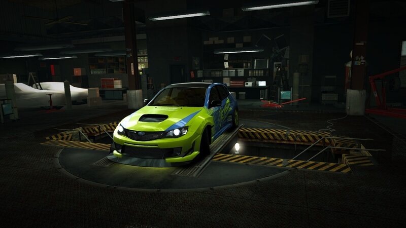 green and blue car in garage