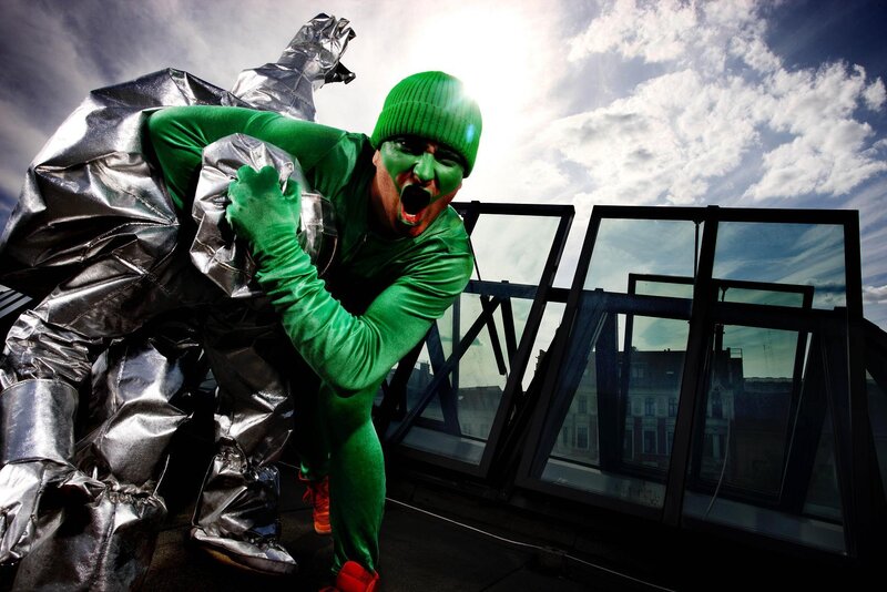 Green and silver costumed performers