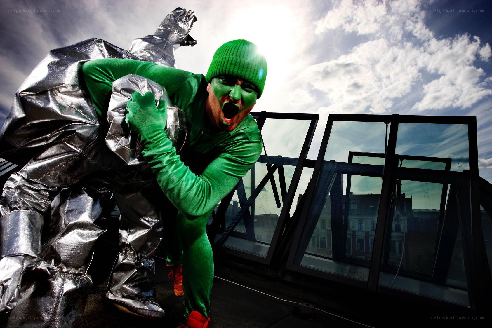 Green and silver costumed performers