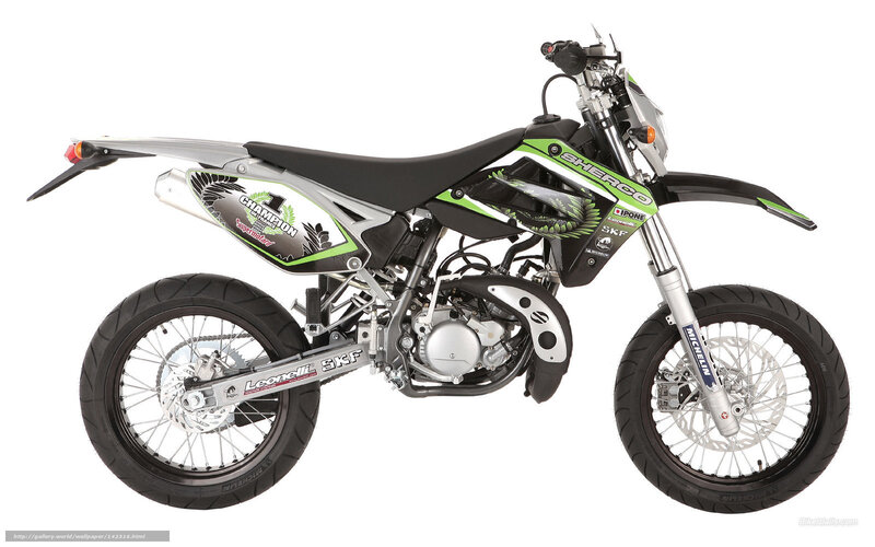 green and silver dirt bike