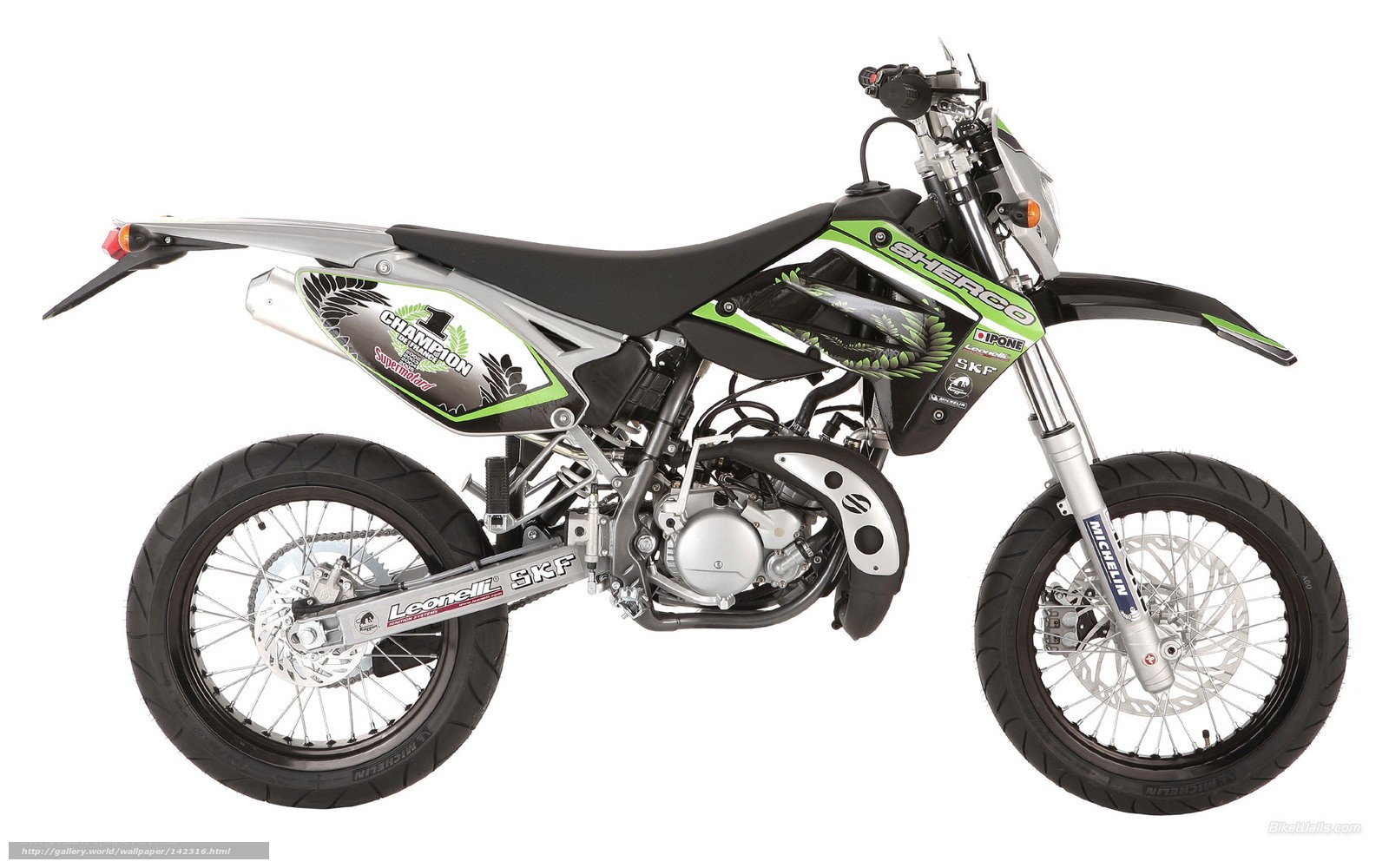 green and silver dirt bike