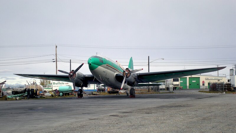 Green and silver propeller plane