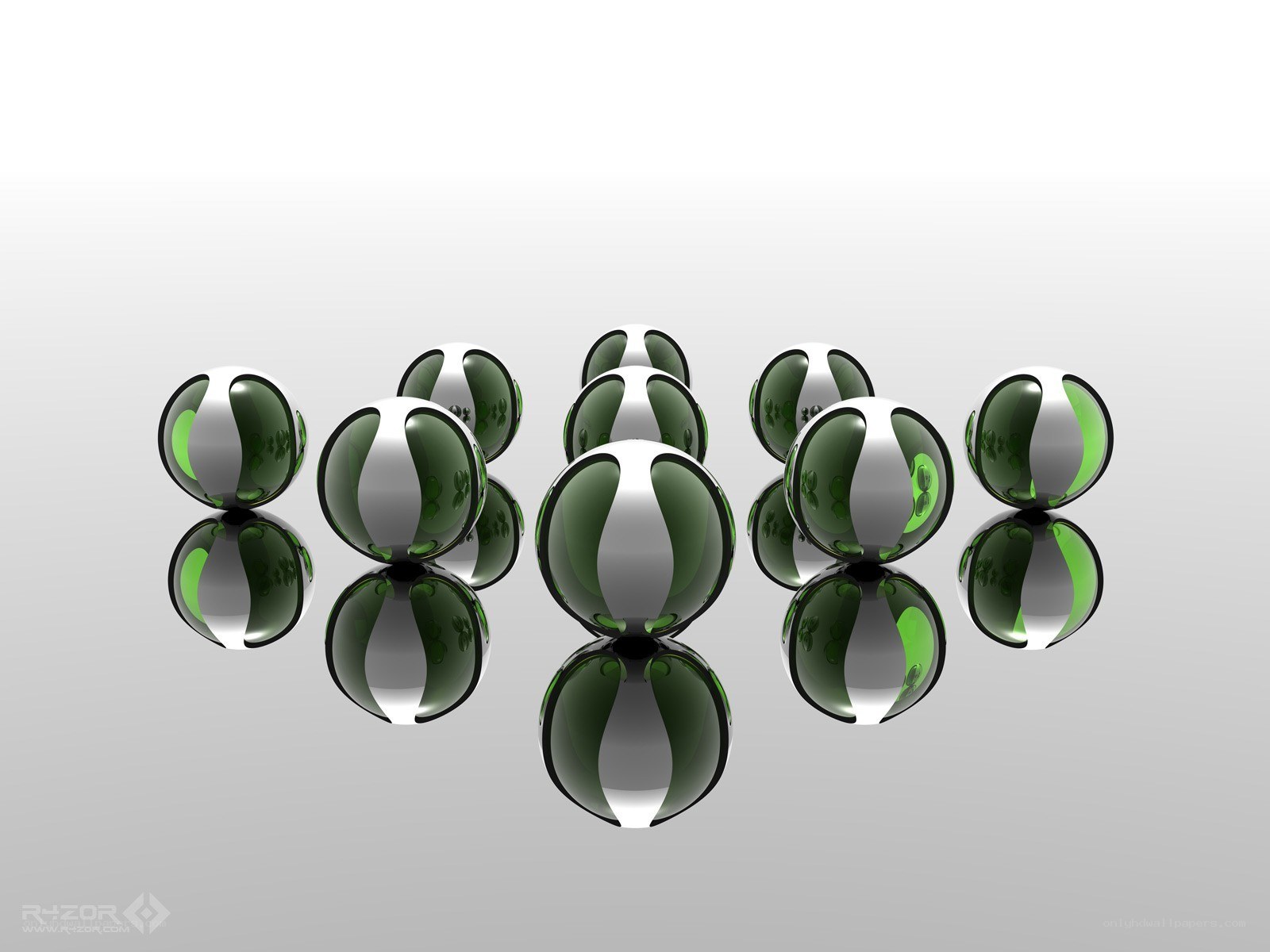 Green and silver spheres on reflective surface