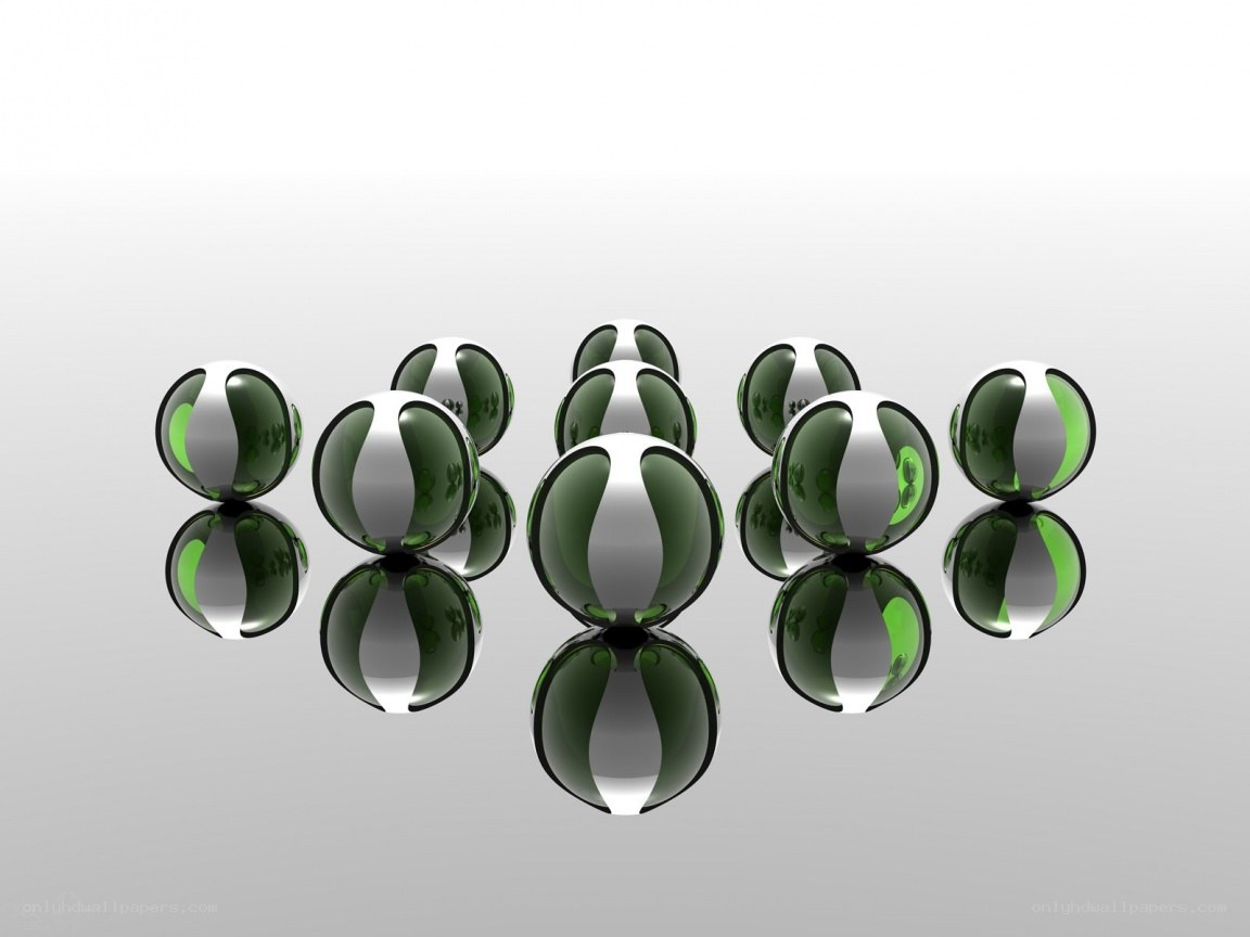 green and silver spheres on reflective surface