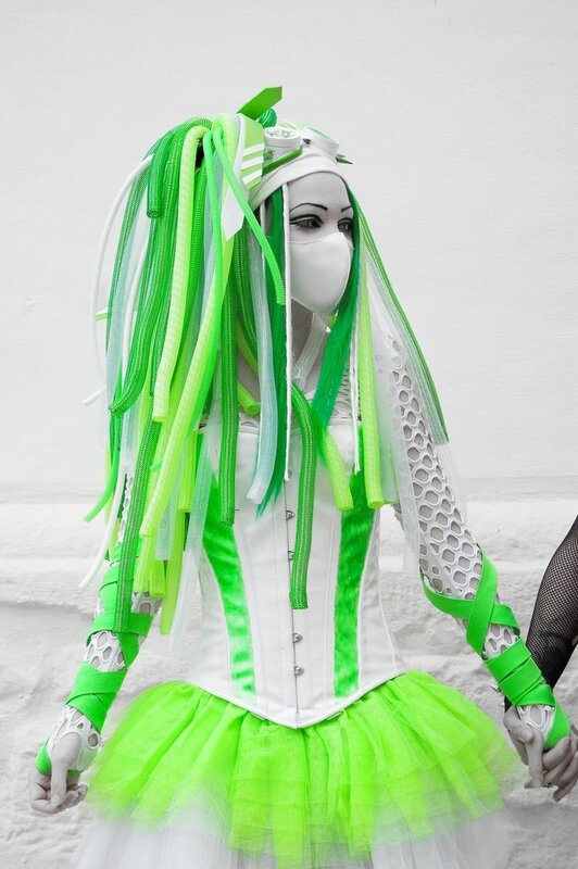 green and white costume with mask