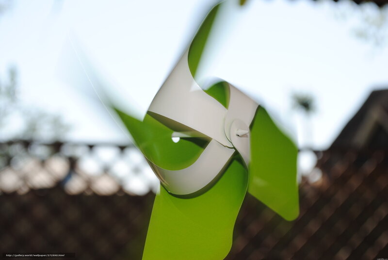 Green and white pinwheel spinning