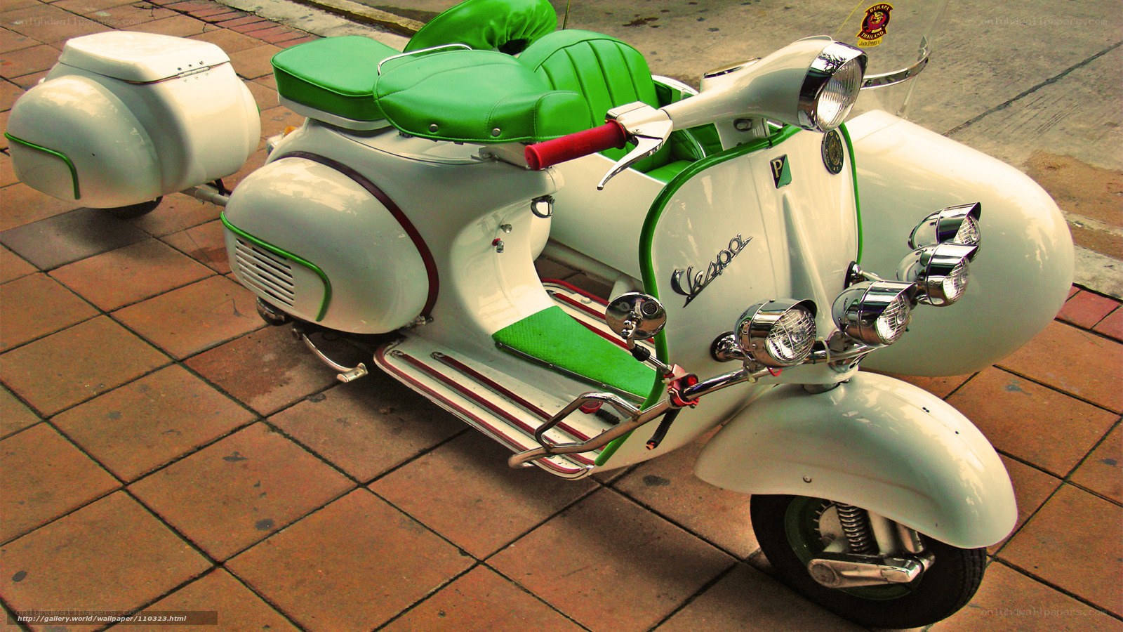 Green and white Vespa scooter