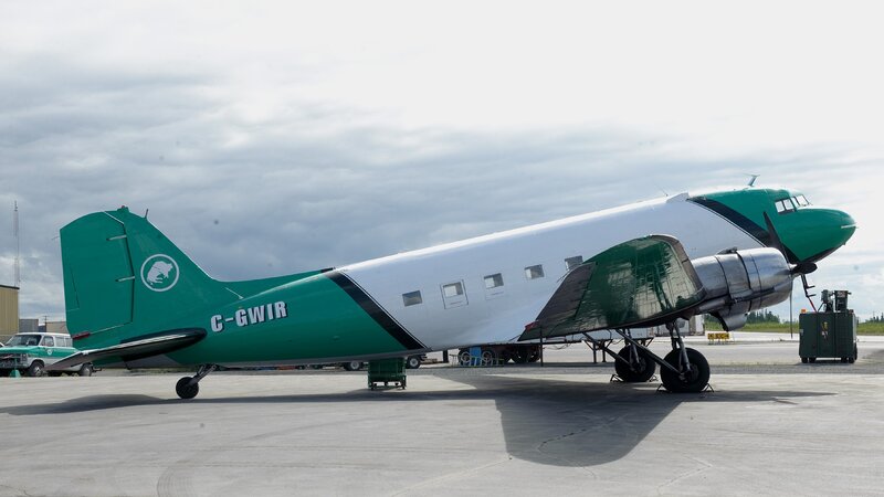 Green and white vintage airplane