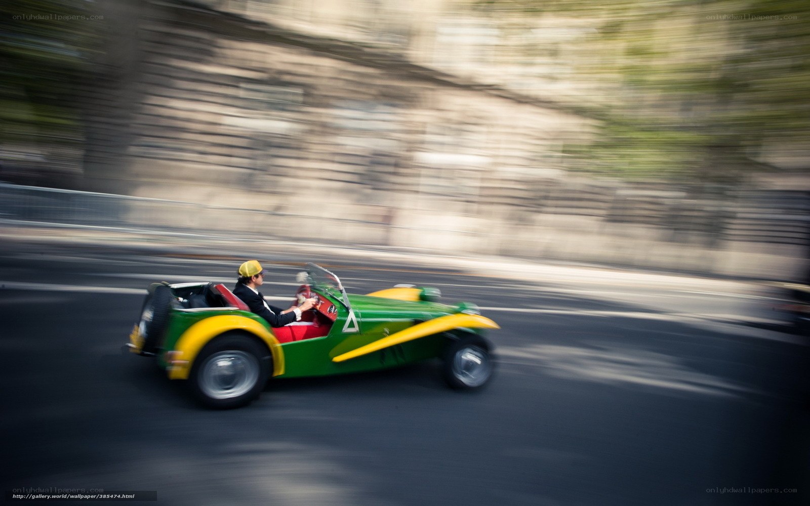 Green and yellow car in motion