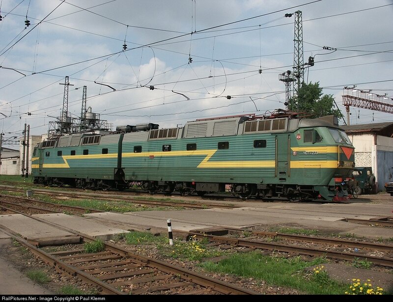 green and yellow electric locomotive