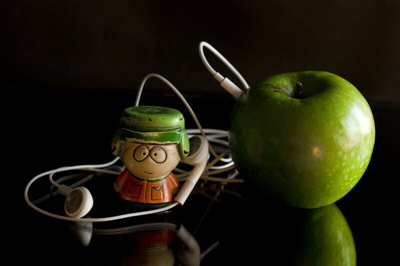 Green Apple and Figurine