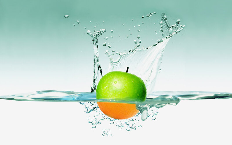 Green Apple in Water — Dynamic, Photograph, Orange