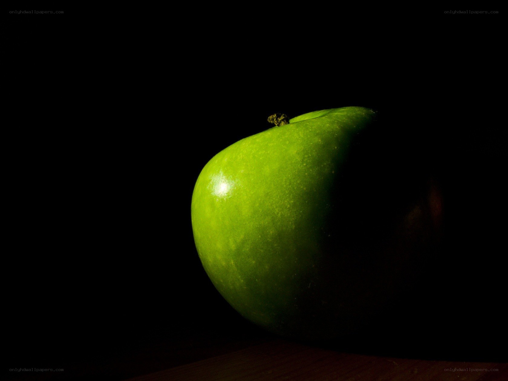green apple on black background