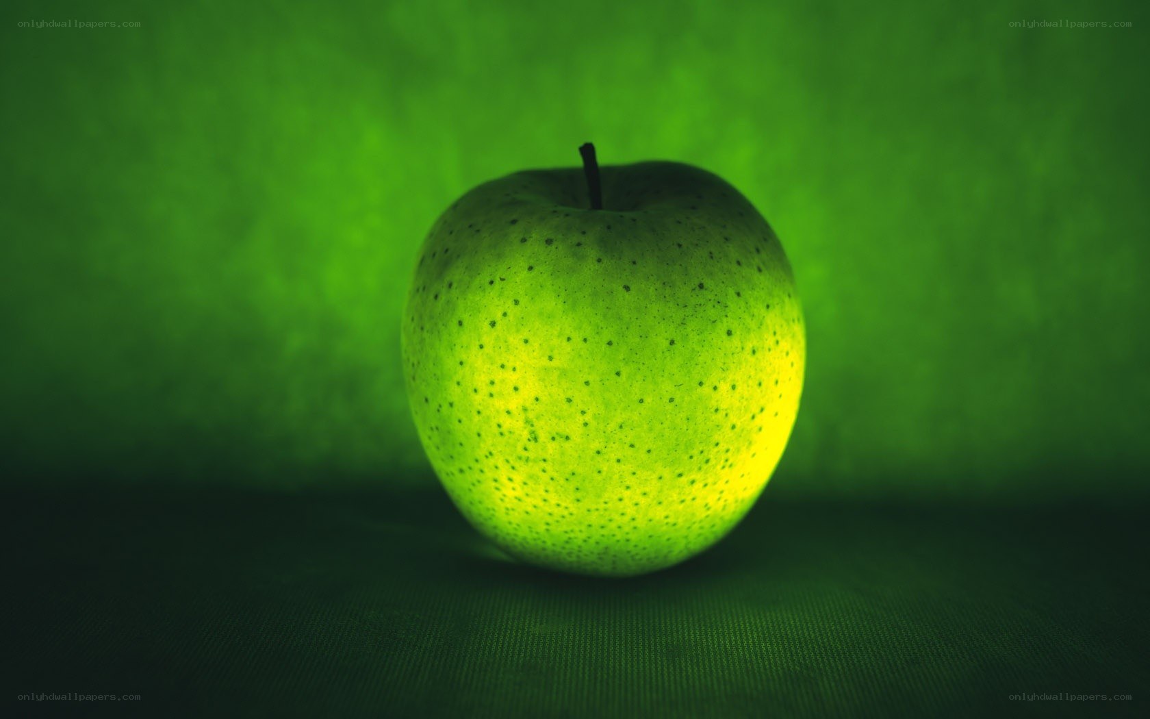 green apple on green background