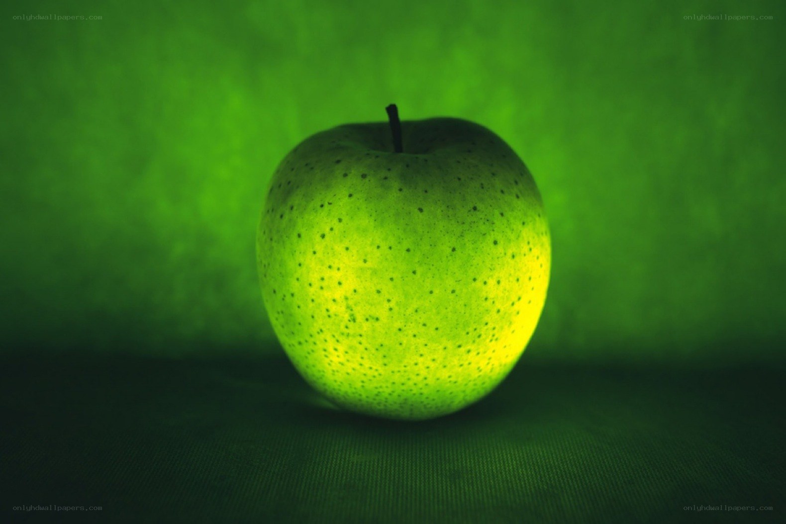 green apple under green light