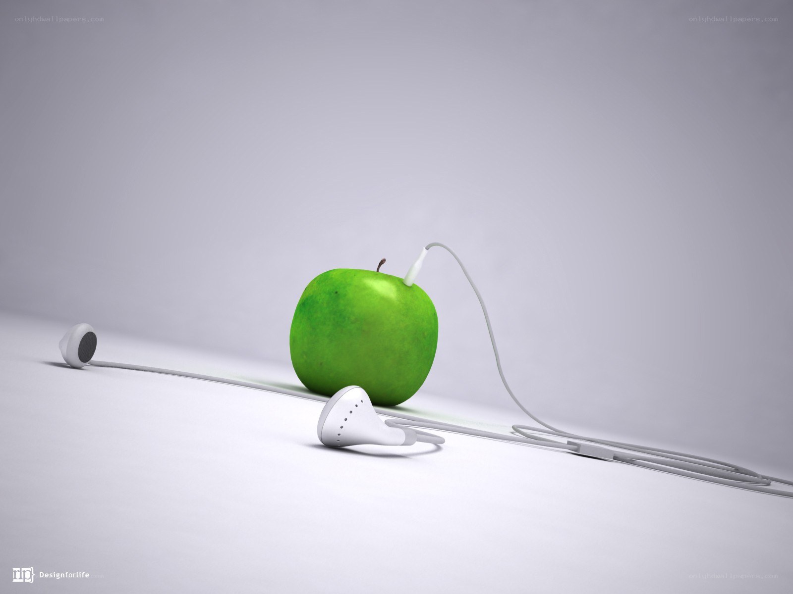 green apple with earbuds