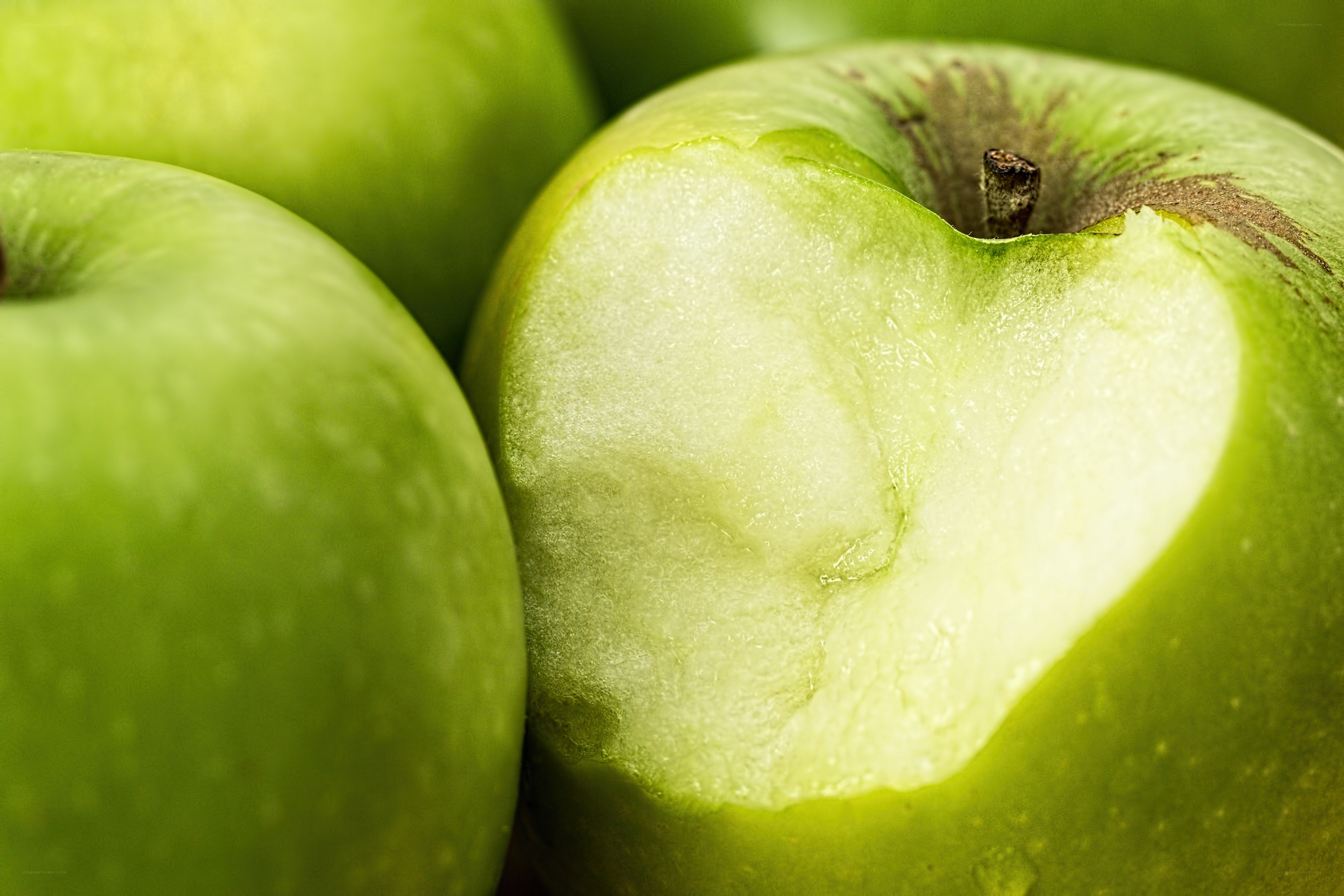 green apple with heart-shaped bite