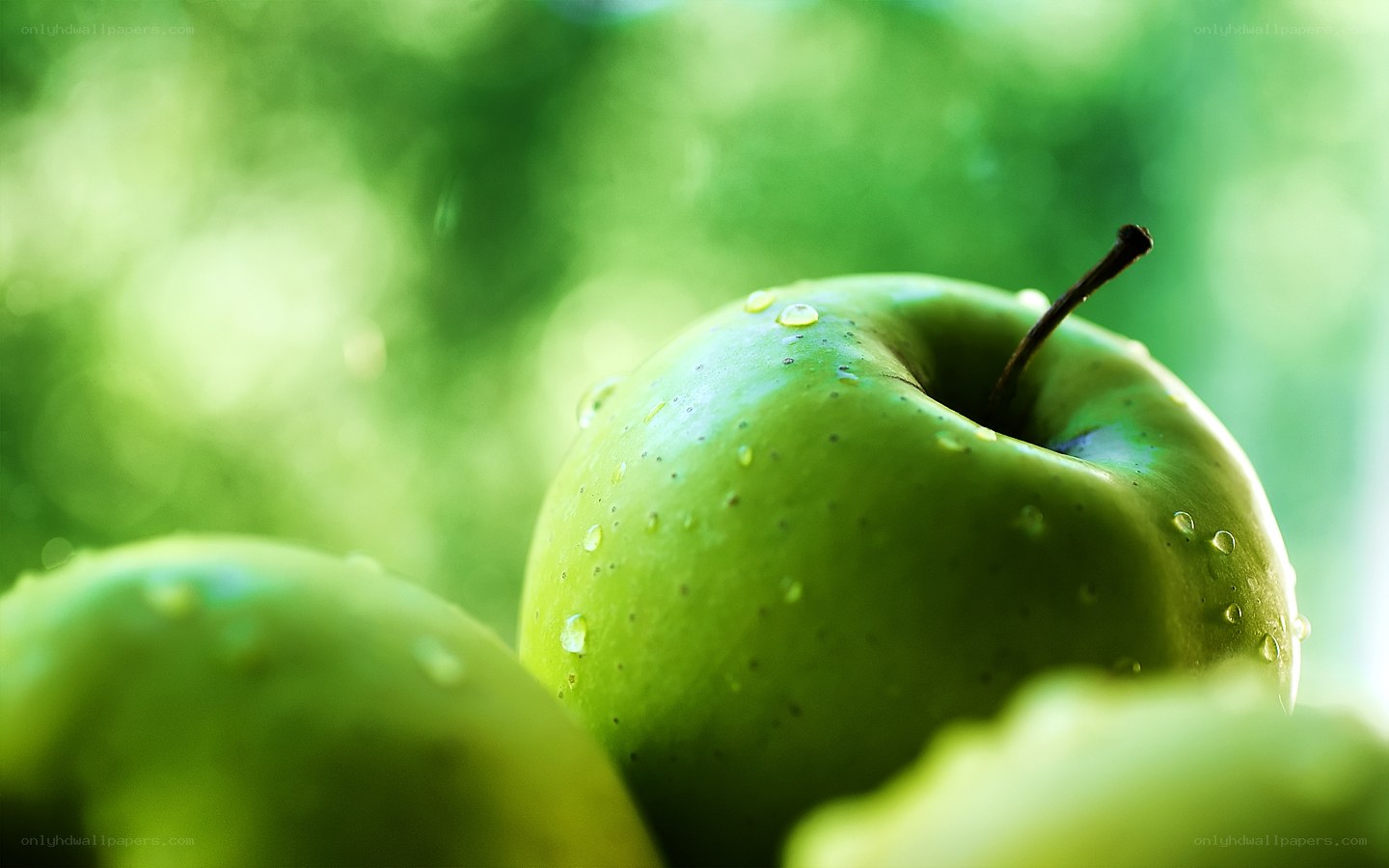 green apple with water droplets