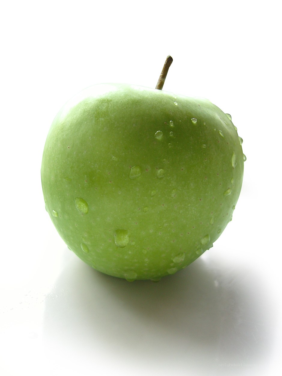 green apple with water droplets