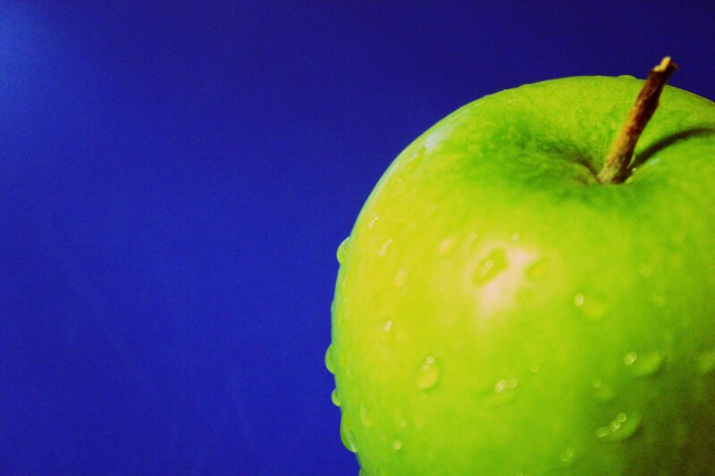 Green Apple with Water Droplets — Dramatic