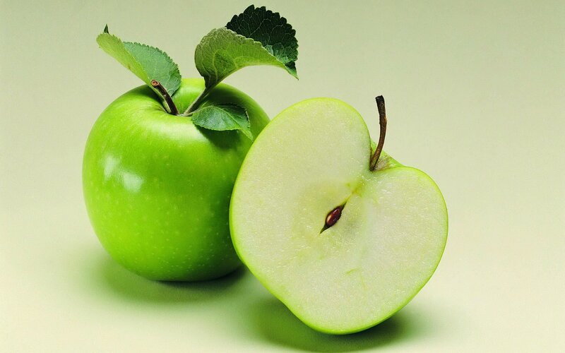 green apples with leaves