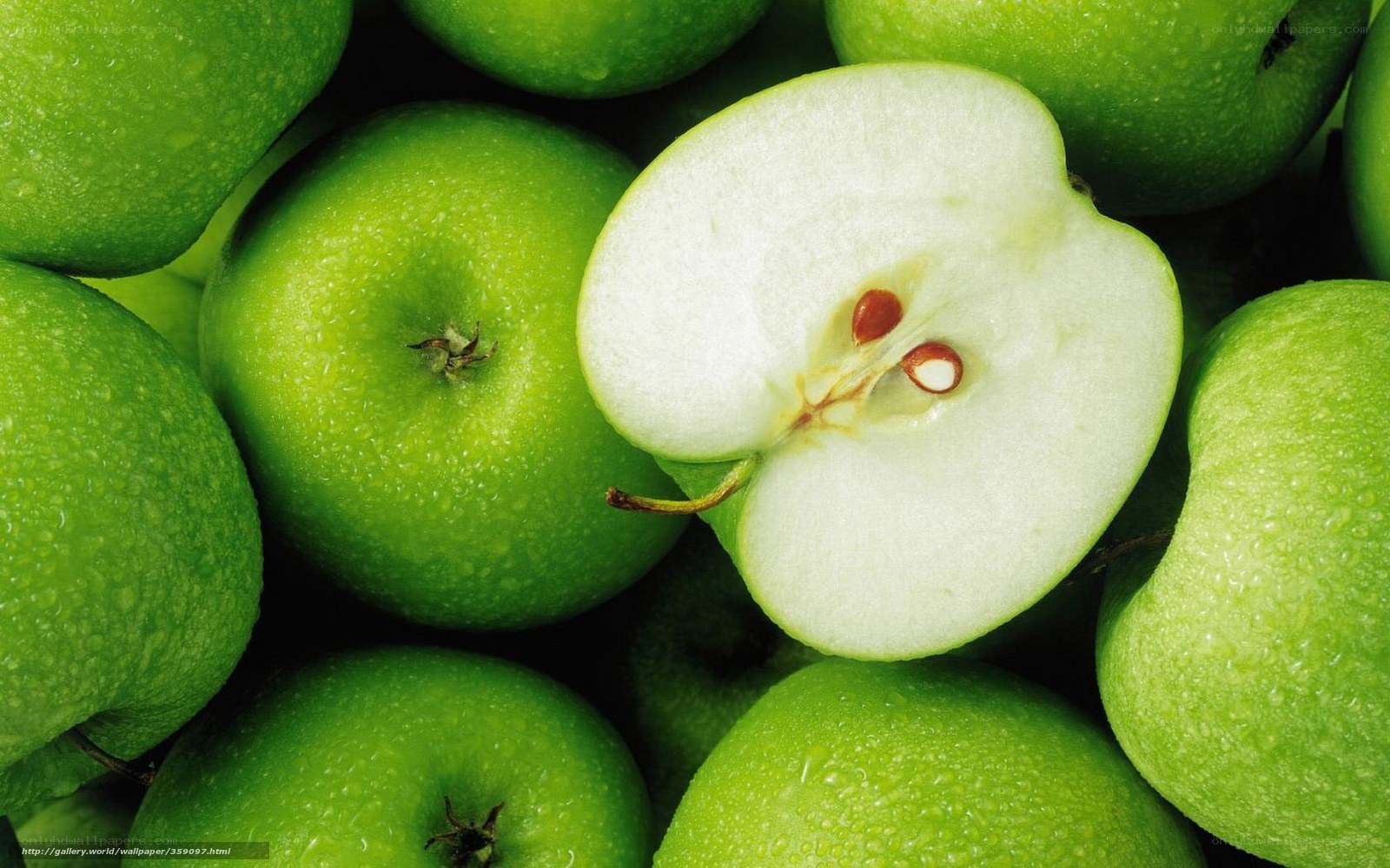 green apples with one cut in half
