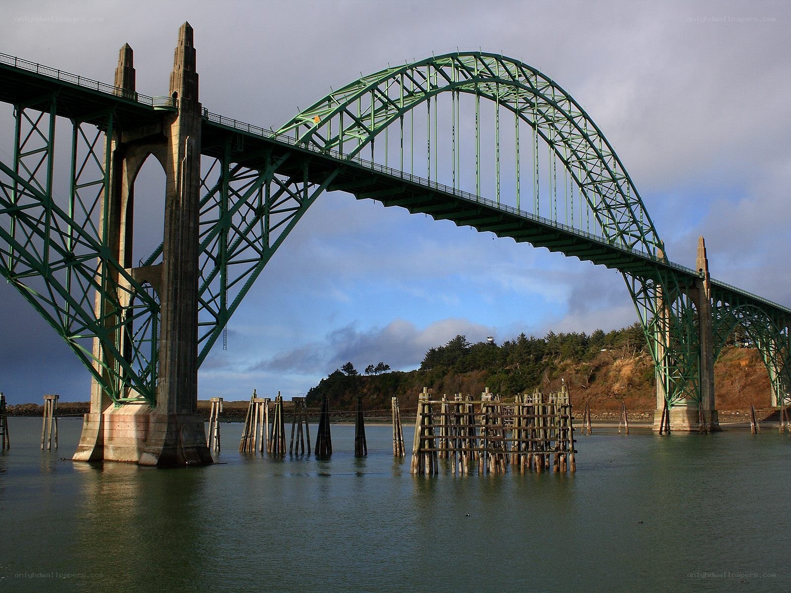 green arch bridge over water