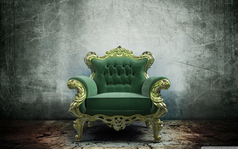 green armchair with gold accents