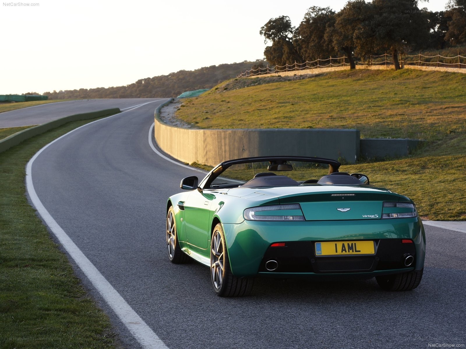 Green Aston Martin on a track
