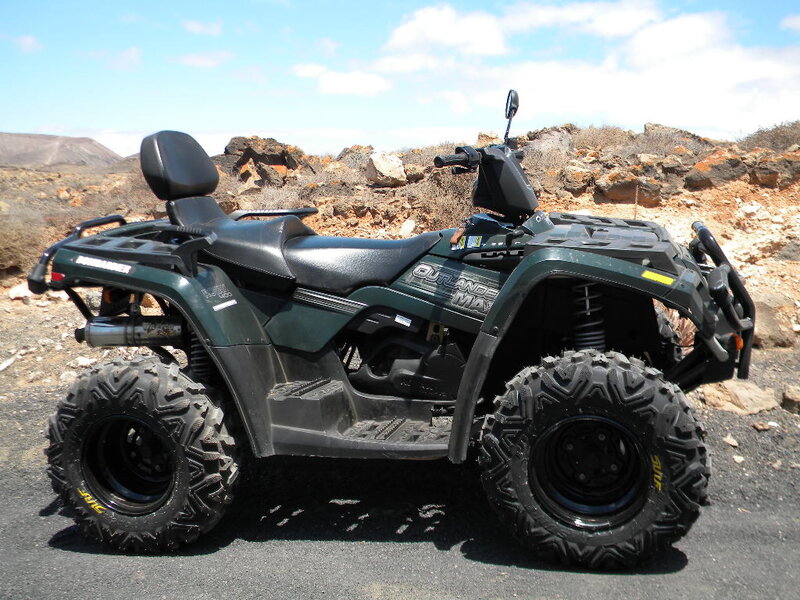 Green Atv on Rocky Terrain