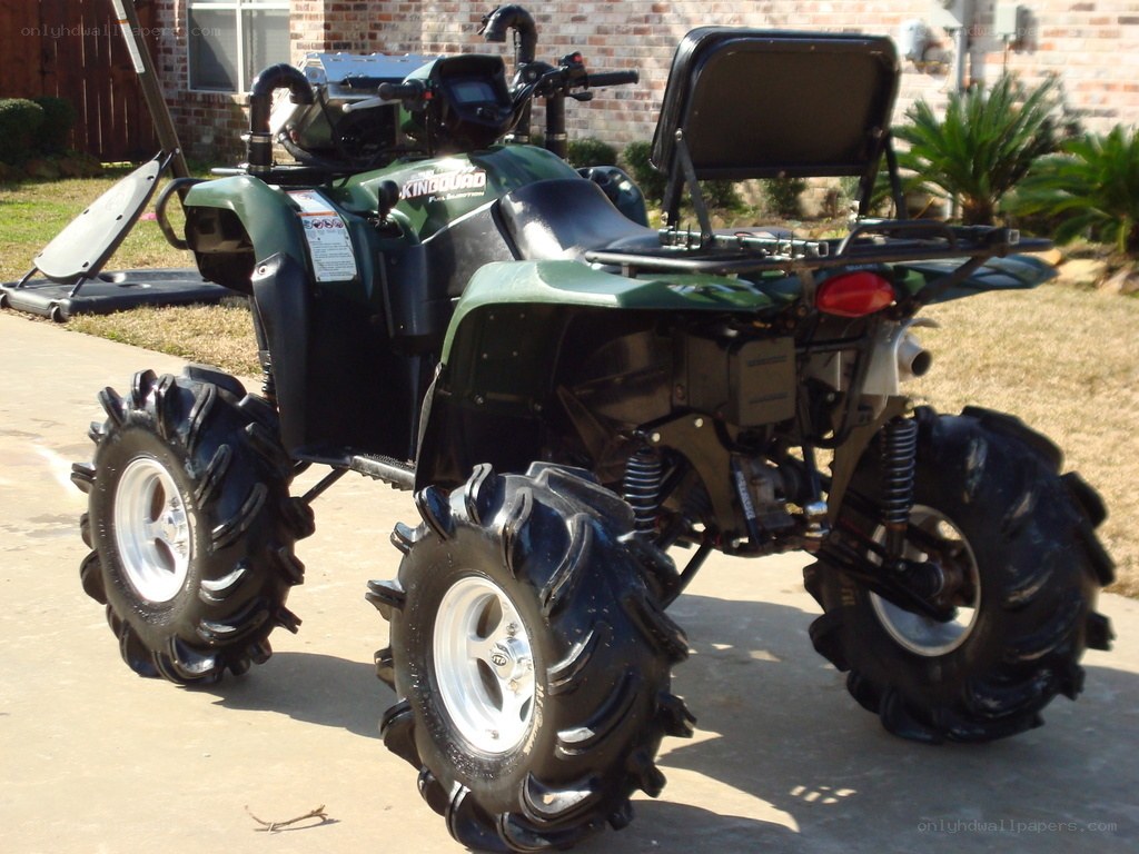 green atv with large tires