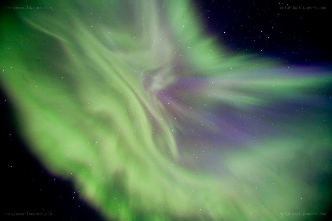 Green aurora in night sky