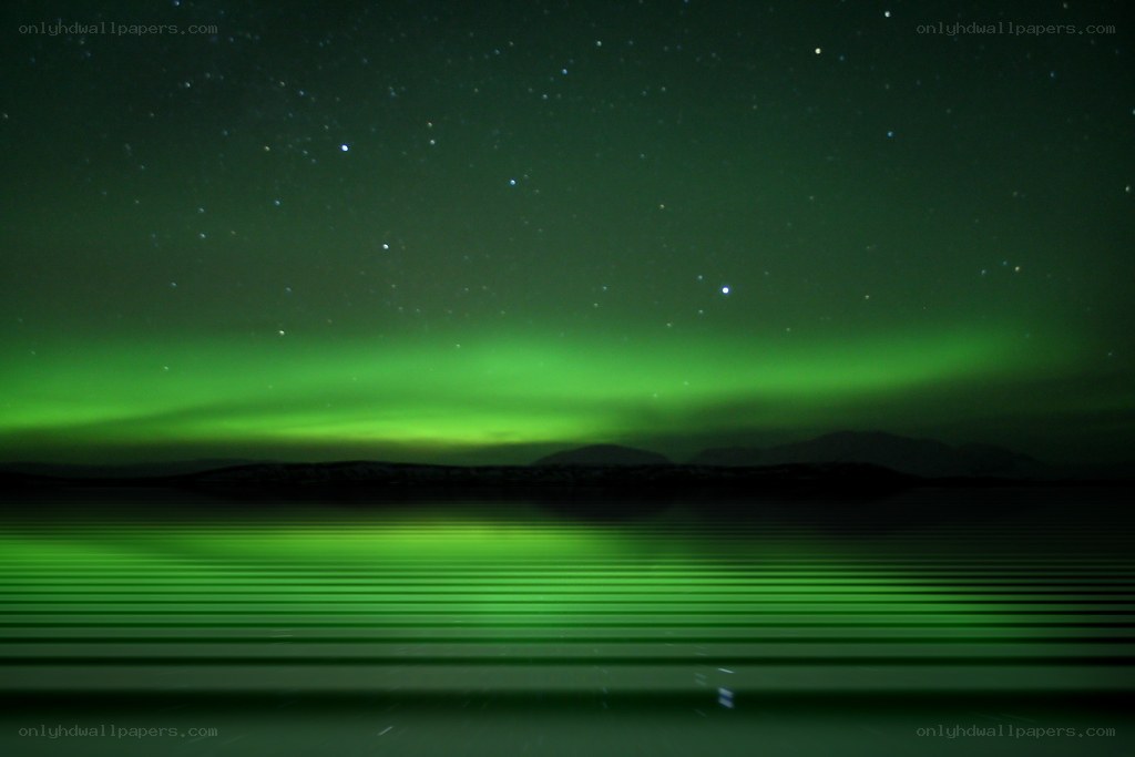 Green aurora over a lake