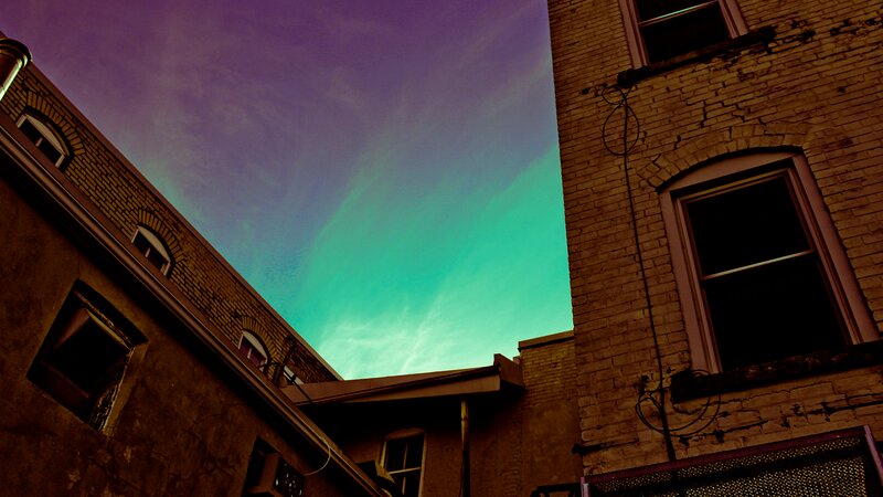 Green Aurora over Buildings