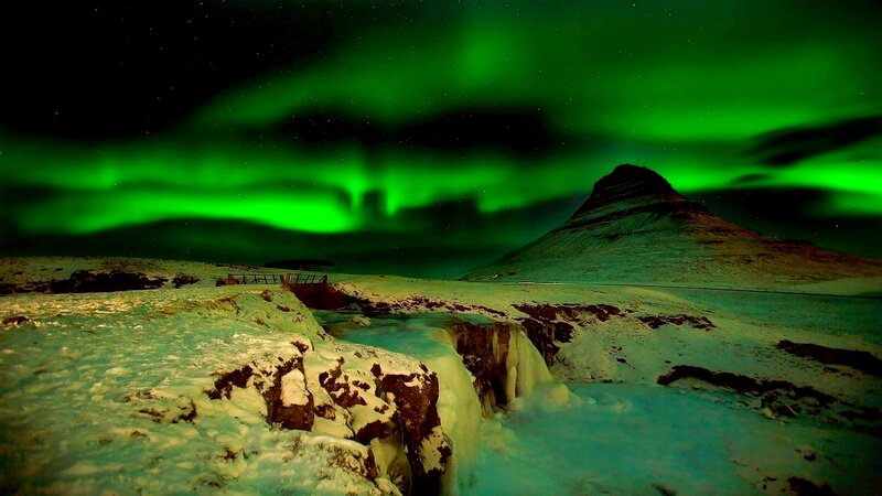 Green Aurora over Mountain — Dramatic