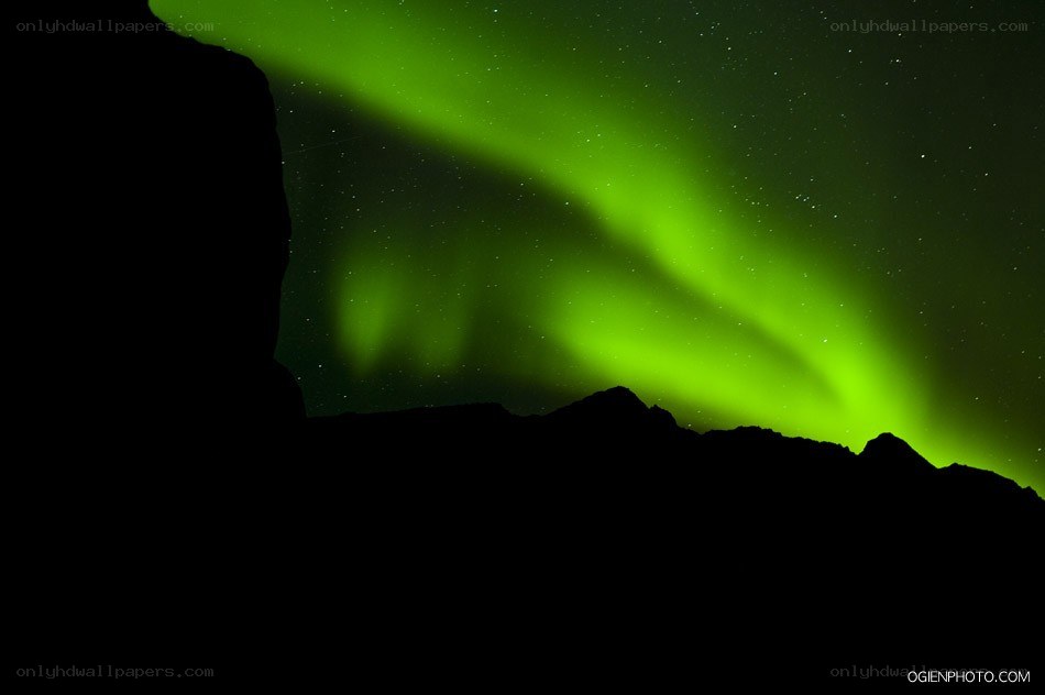 Green Aurora Over Mountains