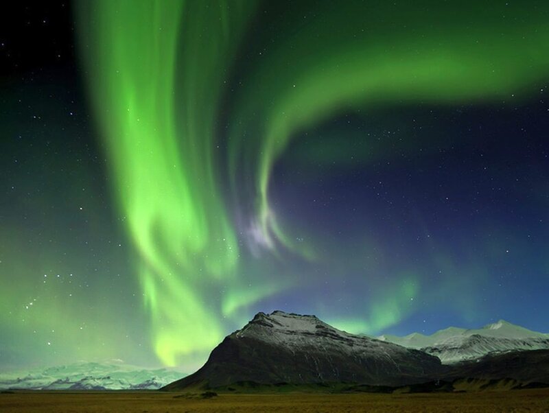 Green Aurora over Mountains — Dramatic