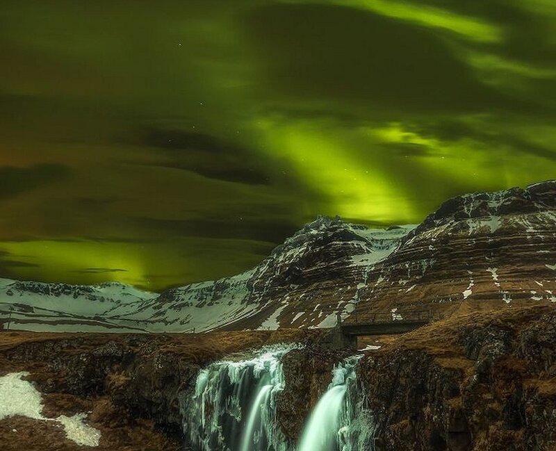 Green Aurora over Waterfall