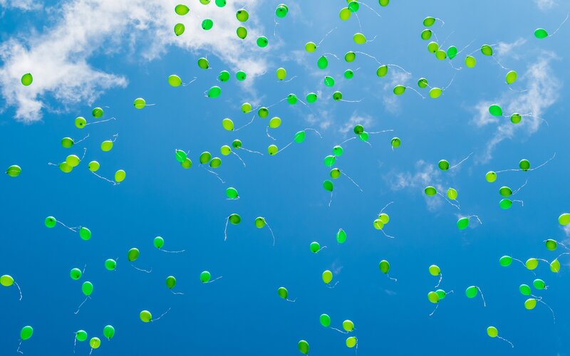 Green Balloons in Sky