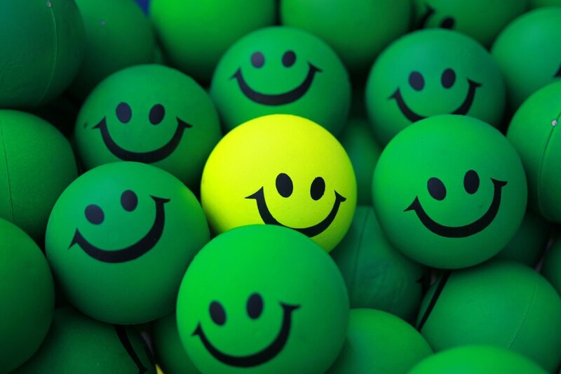 Green Balls with Smiley Faces — Playful, Photograph