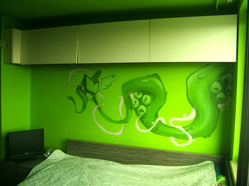green bedroom with mural